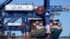 FILE - A container ship is unloaded at Port Botany in Sydney, Australia, Oct. 5, 2021. 