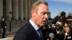 FILE - Acting Defense Secretary Pat Shanahan speaks with the media as he waits for the arrival of NATO Secretary General Jens Stoltenberg at the Pentagon in Washington, Jan. 28, 2019. 