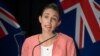 FILE - New Zealand Prime Minister Jacinda Ardern announces the country will move to a COVID red traffic light setting during a press conference at Parliament in Wellington, Jan. 23, 2022.