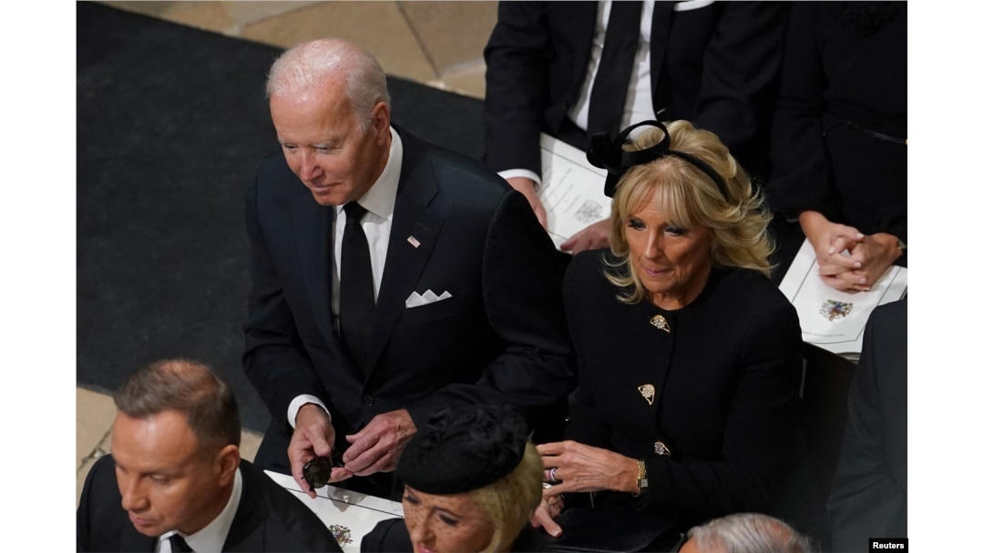 US President Joe Biden accompanied by the First Lady Jill Biden arriving for the State Funeral of Queen Elizabeth II, held at Westminster Abbey, Sept. 19, 2022. (Gareth Fuller/Pool via Reuters)