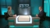 Australian Secret Intelligence Service director-general Paul Symon speaks to Australian Broadcasting Corporation host Leigh Sales during a televised interview.