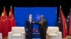 In this photo released by Xinhua News Agency, Papua New Guinea (PNG) Prime Minister James Marape at right bumps elbows with visiting Chinese Foreign Minister Wang Yi in Port Moresby, Papua New Guinea, Friday, June 3, 2022.
