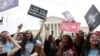 Anti-abortion demonstrators celebrate outside the United States Supreme Court as the court rules in the Dobbs v Women's Health Organization abortion case, overturning the landmark Roe v Wade abortion decision in Washington, U.S., June 24, 2022. 