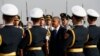 U.S. President Barack Obama passes an honor guard upon his arrival in Beijing, Nov. 10, 2014.