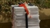 A stack of papers with about 100,000 names calls on the U.S. government to stop all legal action against James Risen, Aug. 14, 2014.