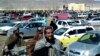 FILE - This screen grab from a video taken on Feb. 22, 2024, shows Afghan men leaving a football stadium after attending the public execution by Taliban authorities of two men convicted of murder, in Ghazni. On Feb. 26, 2024, an execution took place in Sheberghan.