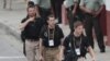 U.S. secret service agents walk around the Convention Center in Cartagena, Colombia, prior to the opening ceremony of the 6th Summit of the Americas, April 14, 2012. 