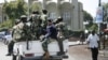 M23 rebels patrol around Congo's Central Bank in Goma, eastern Congo, November 26, 2012.