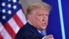 FILE - U.S. President Donald Trump gestures after speaking on election night, Nov. 3, 2020, in the East Room of the White House in Washington.