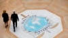 FILE - People walk past the Interpol logo at the headquarters of the international police agency in Lyon, France, Nov.8, 2018. 