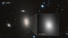 Image of the massive galaxy NGC 1600, and the bright center of the galaxy where the 17-billion-solar-mass black hole resides. (ESA/Hubble image courtesy of STScI) 