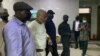FILE - The Nigeria State Secret Police escort separatist leader Nnamdi Kanu, second from left, outside the Federal High Court in Abuja, Nigeria, on Oct. 21, 2021. 