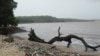 FILE - Plastic trash on the shoreline of cocoa beach in India.