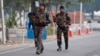 FILE - Indian security forces patrol inside the Indian air force base that came under attack Saturday in Pathankot, India, Jan. 3, 2016.