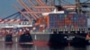 FILE - Container ships are seen docked at the Port of Los Angeles, Feb. 23, 2015.