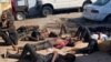 Les quatorze personnes qui ont survécu à la tragédie sont couchés à terre. (Photo: Andre Batista / VOA)