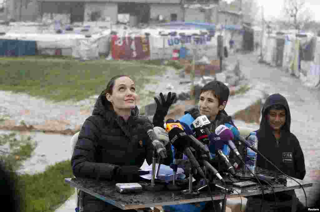 United Nations High Commissioner for Refugees (UNHCR) Special Envoy Angelina Jolie reacts as it rains during a news conference during her visit to Syrian refugees in the Bekaa valley, Lebanon, March 15, 2016.
