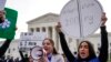 Abortion rights activists rally in front of the U.S. Supreme Court on March 26, 2024, in Washington. 