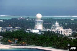 FILE - An aerial view of the city of Sansha on an island in the disputed Paracel chain, which China considers part of Hainan province, July 27, 2012.
