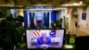 An image on a monitor shows U.S. President Donald Trump speaking during in a video posted on the White House Twitter feed, in the empty Brady Briefing Room of the White House in Washington, Jan. 13, 2021.