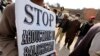 Relatives of people who have gone missing in Pakistan's restive province of Baluchistan hold up signs