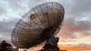 FILE - A radio telescope at the Parkes Observatory is pictured at sunset near the town of Parkes, Australia, July 15, 2019. The new Square Kilometre Array project will combine 130,000 antennas and 200 satellite dishes.
