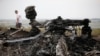 Debris at the site of Thursday's Malaysia Airlines Boeing 777 plane crash, near the village of Grabovo in Ukraine's Donetsk region, July 18, 2014.
