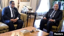 Egypt's Foreign Minister Sameh Shoukry (R) is pictured during a meeting with his Sudanese counterpart Ibrahim Ghandour in Cairo, Egypt, June 3, 2017. 