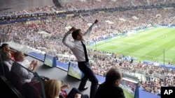 French President Emmanuel Macron reacts during the final match between France and Croatia at the 2018 soccer World Cup in the Luzhniki Stadium in Moscow, July 15, 2018. 