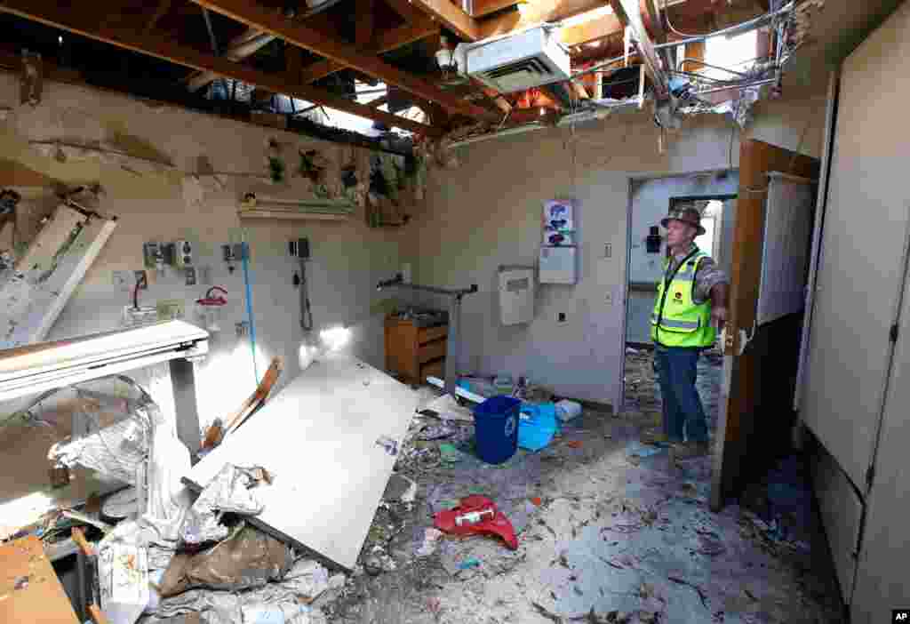 Joe Budds, a construction foreman for Otto Construction, inspects one of the rooms at the Feather River Hospital, Oct. 17, 2019, which was damaged during last year&#39;s Camp Fire in Paradise, Calif.