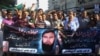 FILE - Pakistani journalists in Karachi shout slogans condemning the killing of journalists, Sept. 9, 2015. 