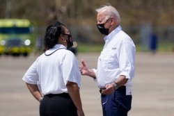 President Joe Biden talks with New Orleans Mayor LaToya Cantrell as he arrives at Louis Armstrong New Orleans International Airport in Kenner, Louisiana, Sept. 3, 2021, to tour damage caused by Hurricane Ida.