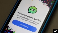 Facebook's Messenger Kids app is displayed on an iPhone in New York, Feb. 16, 2018. The app lets kids under 13 chat with friends and family, is ad-free and connected to a parent’s account. 