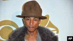 Pharrell Williams arrives at "The Night That Changed America: a Grammy Salute to the Beatles, " Jan. 27, 2014, in Los Angeles