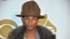 Pharrell Williams arrives at "The Night That Changed America: a Grammy Salute to the Beatles," Jan. 27, 2014, in Los Angeles.
