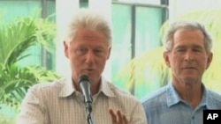 Former presidents Bill Clinton and George Bush speak at donor's conference for Haiti reconstruction aid.