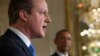 President Barack Obama listens as British Prime Minister David Cameron speaks during their joint news conference in the East Room of the White House, Jan. 16, 2015