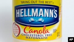 FILE - This Monday, Nov. 17, 2014, file photo, shows a jar of Hellmann's "Canola Cholesterol Free Mayonnaise," in Walpole, Mass. 