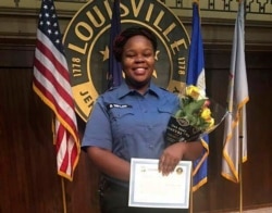 FILE - This undated photo provided by Taylor family attorney Sam Aguiar shows Breonna Taylor in Louisville, Kentucky.