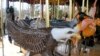 The animals depicted on the National Zoo's Conservation Carousel include many endangered species. (VOA/J. Taboh) 