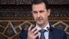Syrian President Bashar al-Assad speaks to Parliament members in Damascus in this photo handed out by SANA, the Syrian Arab News Agency, June 7, 2016.