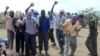 FILE - Participants of an execution by stoning are seen in Afgoye district, Somalia, Dec. 13, 2009. The al-Shabab militant group allegedly stoned to death a 44-year-old man in Rama Addey town in southern Somalia's Bay region, having found him guilty of adulter