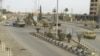 FILE - Syrian army tanks are seen in Deir al-Zour. 