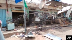 FILE - The wreckage of a bus remains at the site of an airstrike in Saada, Yemen, on Aug. 10, 2018. Yemen's Shiite rebels are backing a United Nations' call for an investigation into a Saudi-led coalition airstrike in the country's north that killed dozens of people.