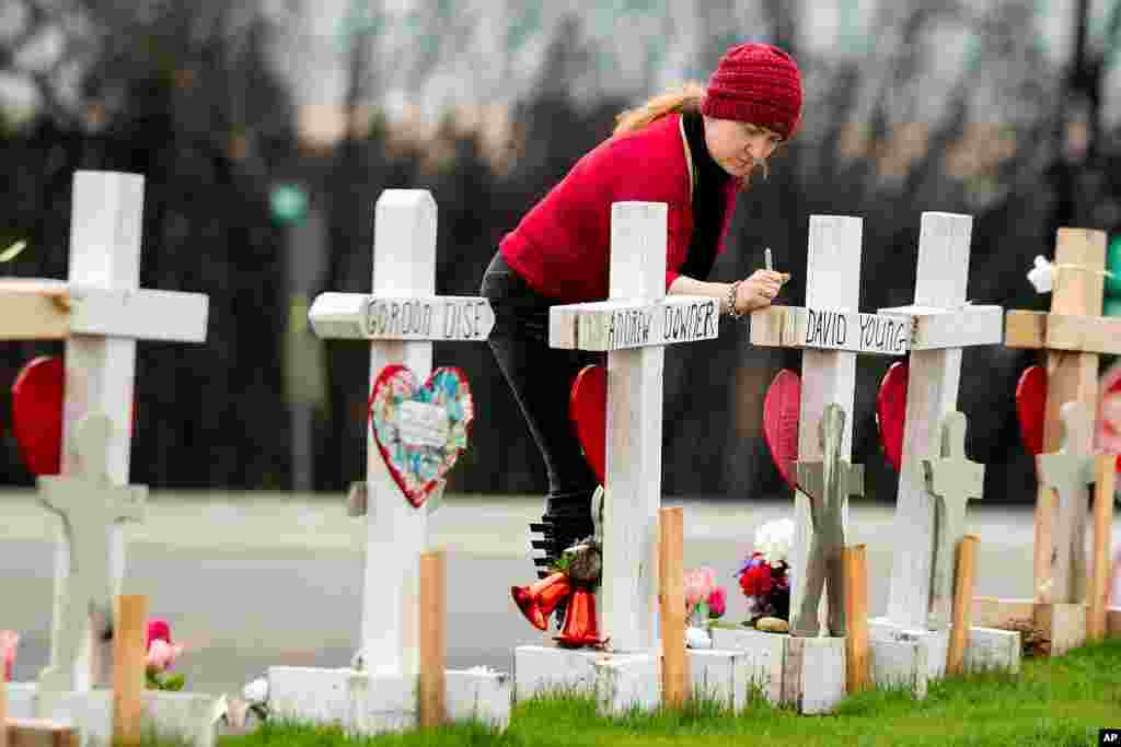Tabatha Miller visits a memorial for Camp Fire victims in Paradise, Calif., Feb. 8, 2019. Miller is helping rescue and re-settle animals displaced during the November 2018 blaze.