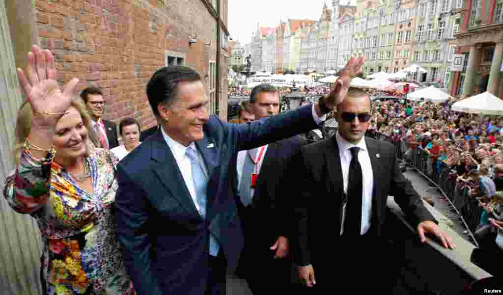 U.S. Republican presidential candidate Mitt Romney and his wife Ann wave to people on the street before his meeting with Poland's Prime Minister Donald Tusk at the Old Town Hall in Gdansk, Poland, July 30, 2012.