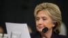 Capres AS dari partai Demokrat, Hillary Clinton, (saat masih menjabat sebagai Menlu AS)membaca email dari Dubes Chris Stevens dalam testimoni di Gedung Capitol, Washington D.C., 22 Oktober 2015. (AP Photo/Evan Vucci).