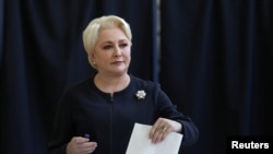 Romanian Prime Minister Viorica Dancila casts her vote during the European Parliament Elections in Bucharest, May 26, 2019. 