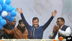 FILE - Delhi Chief Minister Arvind Kejriwal, center, celebrates a Aam Aadmi Party victory in New Delhi, India, Feb. 11, 2020. Kejriwal was arrested March 21, 2024, by the country’s financial crime agency, accused of accepting bribes from liquor contractors.