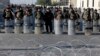 Iraqi riot police close a bridge leading to the heavily guarded Green Zone during a demonstration of followers of Iraq's influential Shiite cleric Muqtada al-Sadr in Baghdad, Iraq, Feb. 11, 2017.